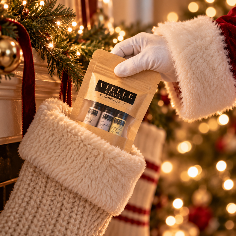Santa tucking the Vielle Mini Trio into a Christmas stocking