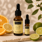 Vielle Serum Vanilla Rind size comparison: 1 oz full-size bottle next to 5 ml travel mini with oranges, lemons, and limes