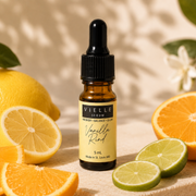 Vielle Serum Vanilla Rind 5 ml travel mini in amber dropper bottle with yellow label, surrounded by fresh citrus